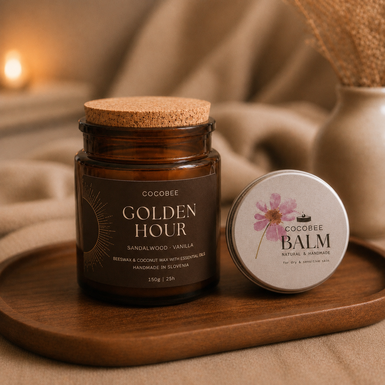 COCOBEE 'Golden Hour' candle and balm on a wooden tray with a warm, blurred background.