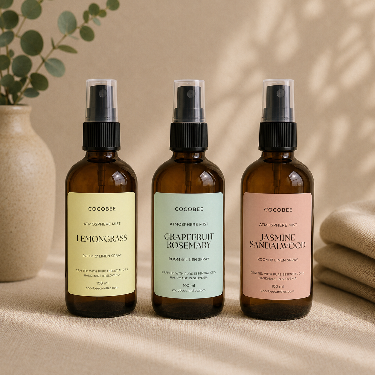 Three CocoBee room and linen sprays in amber bottles