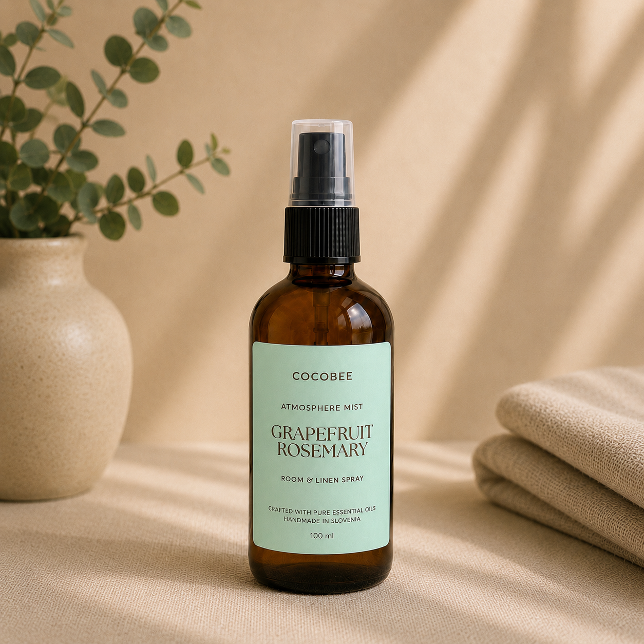 CocoBee Grapefruit Rosemary room and linen spray in an amber bottle
