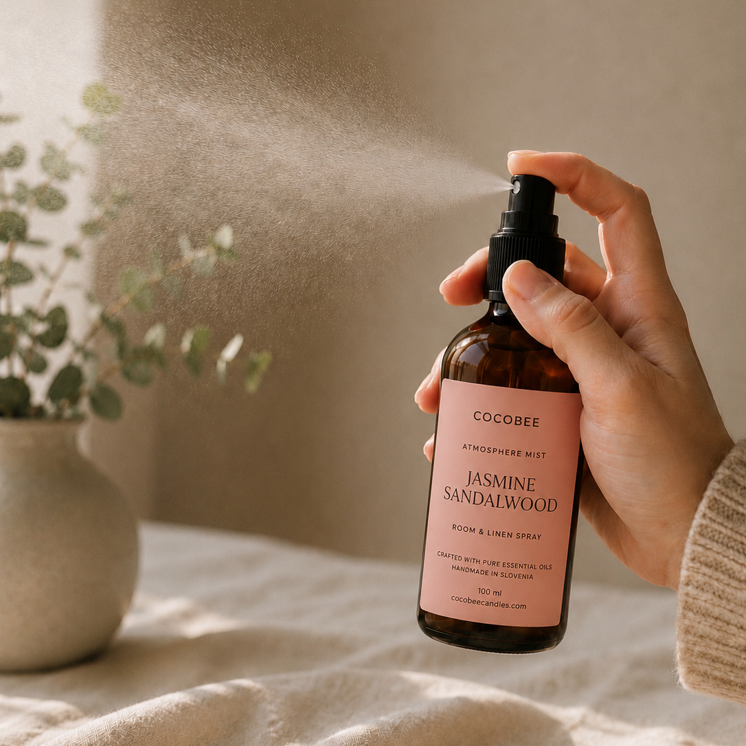 Hand spraying CocoBee Jasmine Sandalwood room and linen spray
