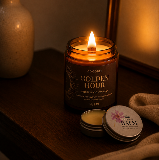 Candle labeled 'Golden Hour' with a balm container on a wooden surface.