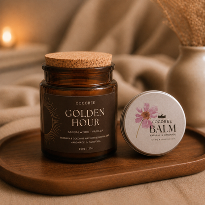 COCOBEE 'Golden Hour' candle and balm on a wooden tray with a warm, blurred background.